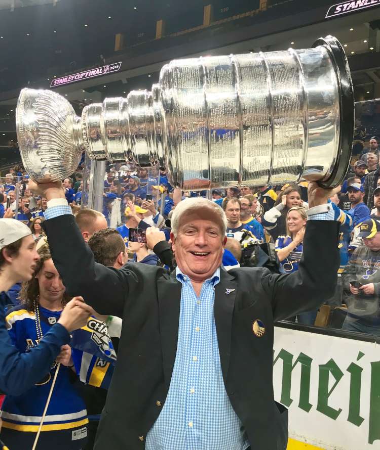 Tom Schlafly holding up the Stanley Cup