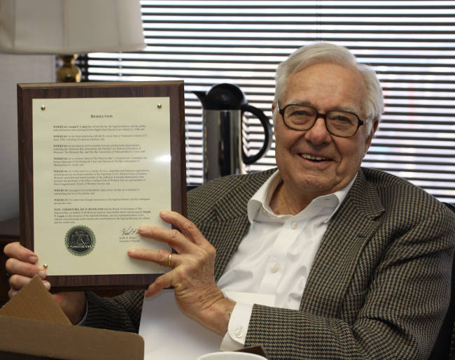 Joe Logan shows his plaque from the Missouri Bar Board of Governors.