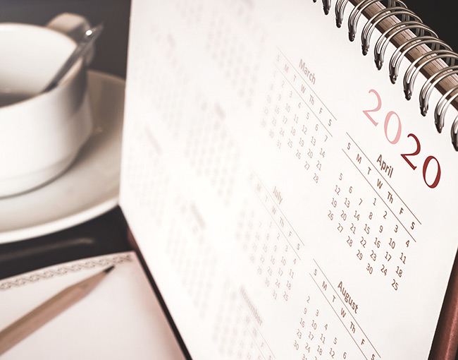 A desktop calendar turned to 2020