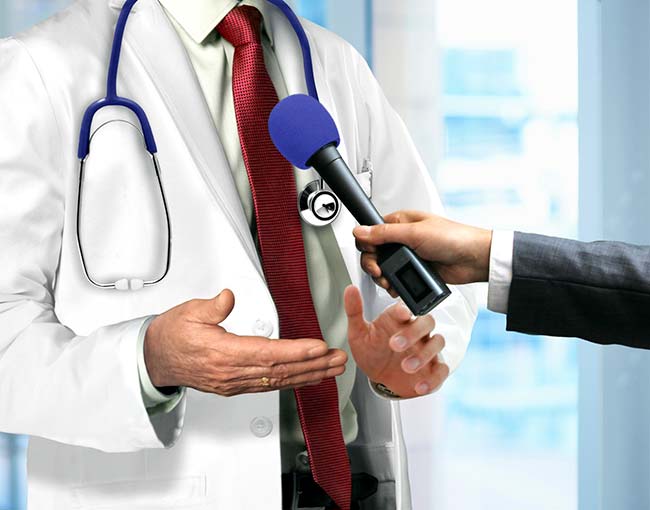 doctor-talking-to-microphone_18556352024_o