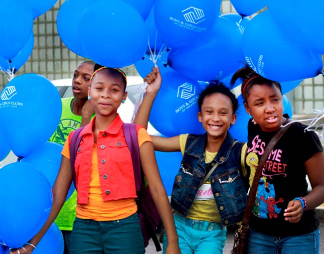 Children with balloons at the Boys and Girls Club announcement 2013