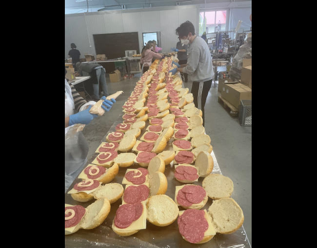 dozens of sandwiches prepared by volunteers